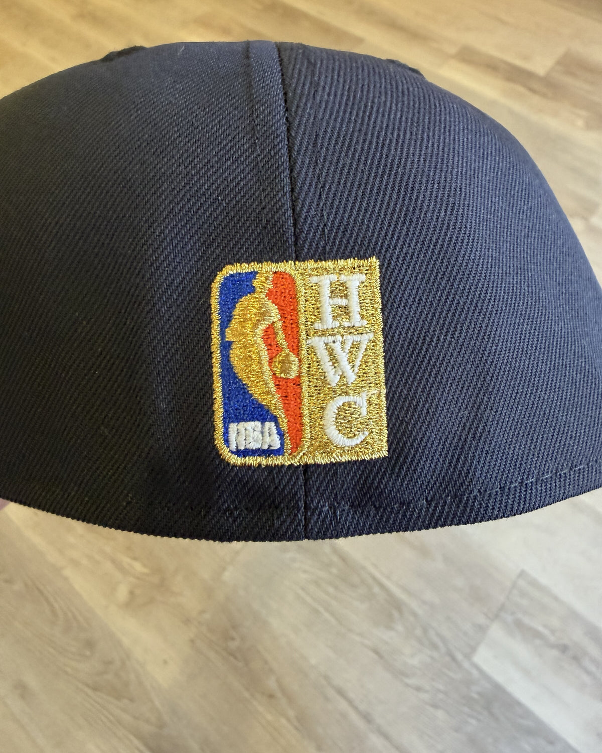 New York Knicks 1998 All Star Weekend 59Fifty, rear view showing the NBA logo and HWC Hardwood Classics patch on the navy back panel