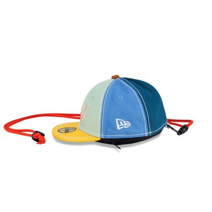 Left side of the Sean Wotherspoon Mini 59Fifty Earphone Case with the New Era flag logo and the zipper along the base
